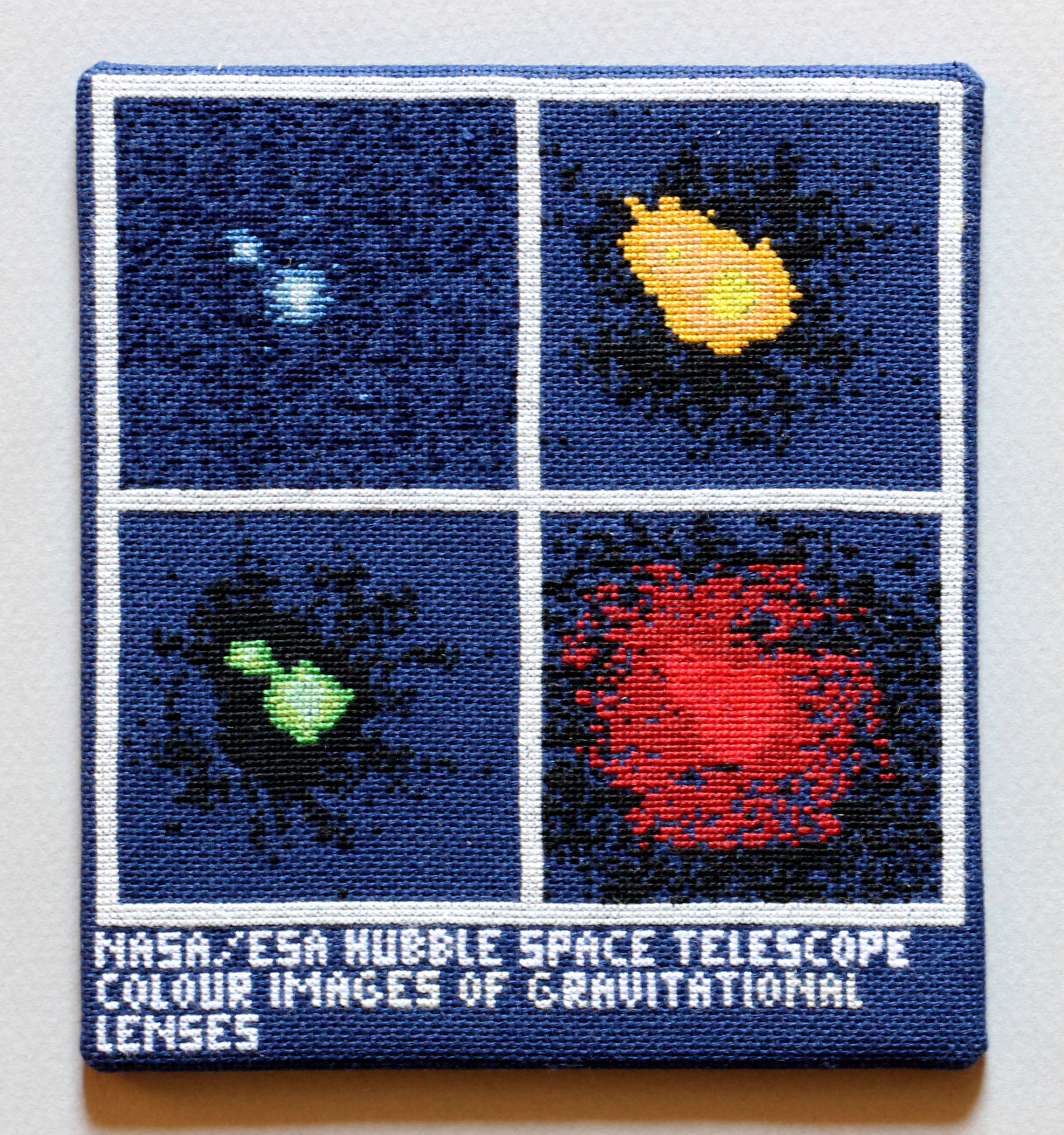  / Cross-stitch embroidery of a distant quasar, inspired by an Hubble shot. Art by artist Marine Beaufils.